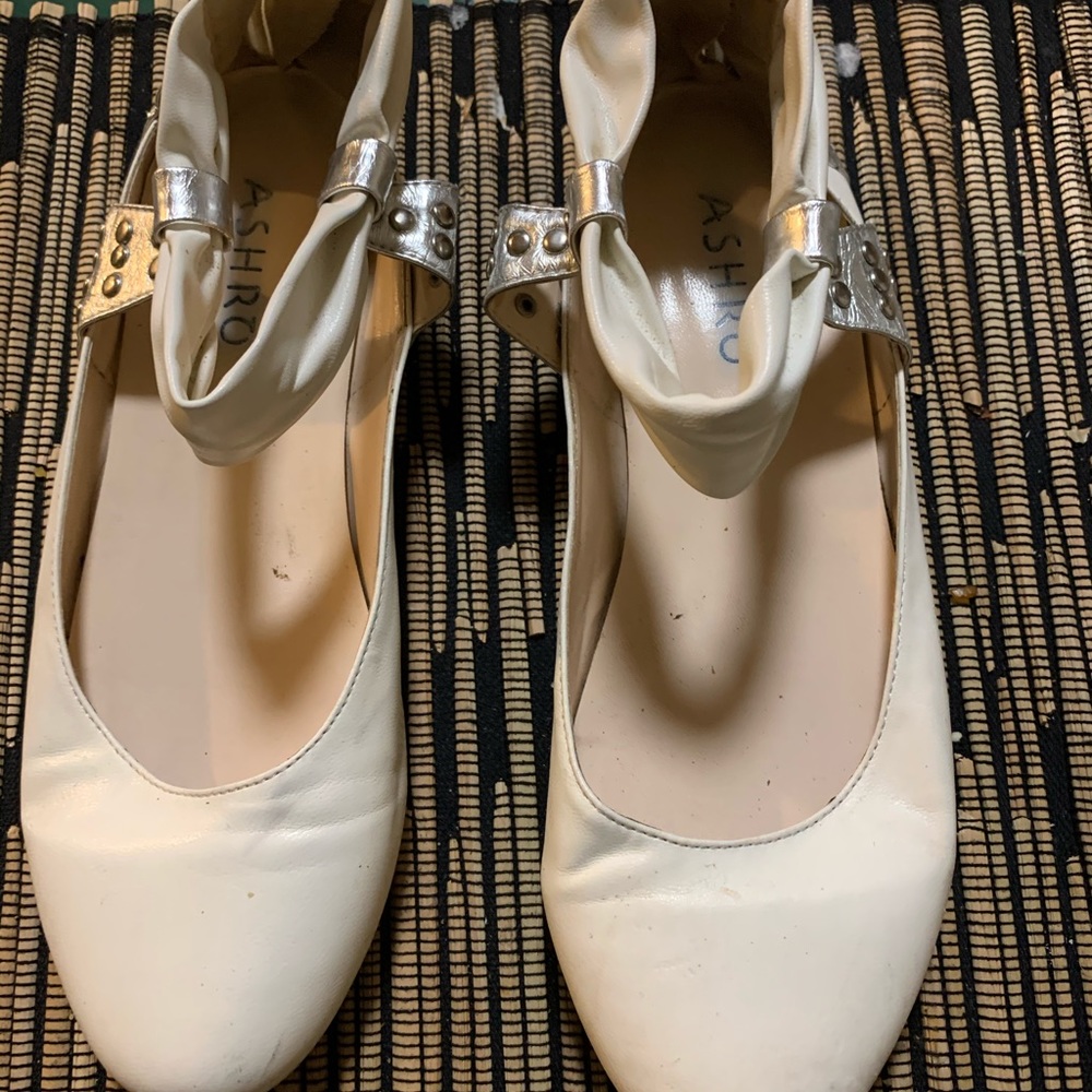 White and gold flat shoes